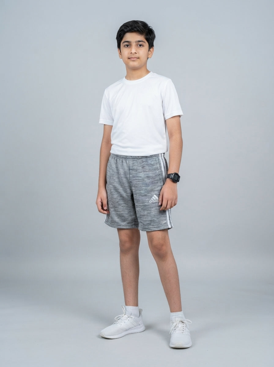 Preloved Adidas teen boys' sports shorts, size 10-12Y, worn by a model, styled