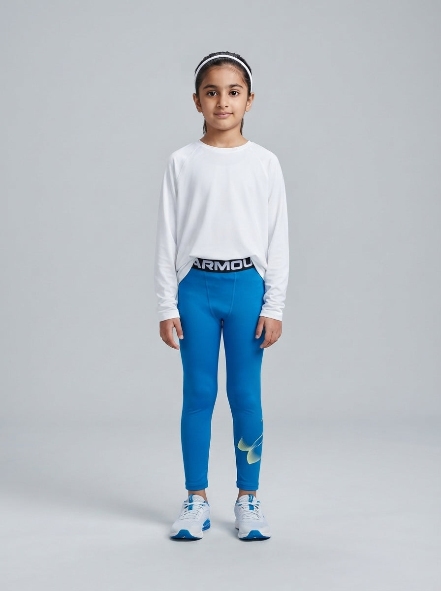 Preloved Under Armour girls' sports leggings, size 5-6Y, worn by a model, styled