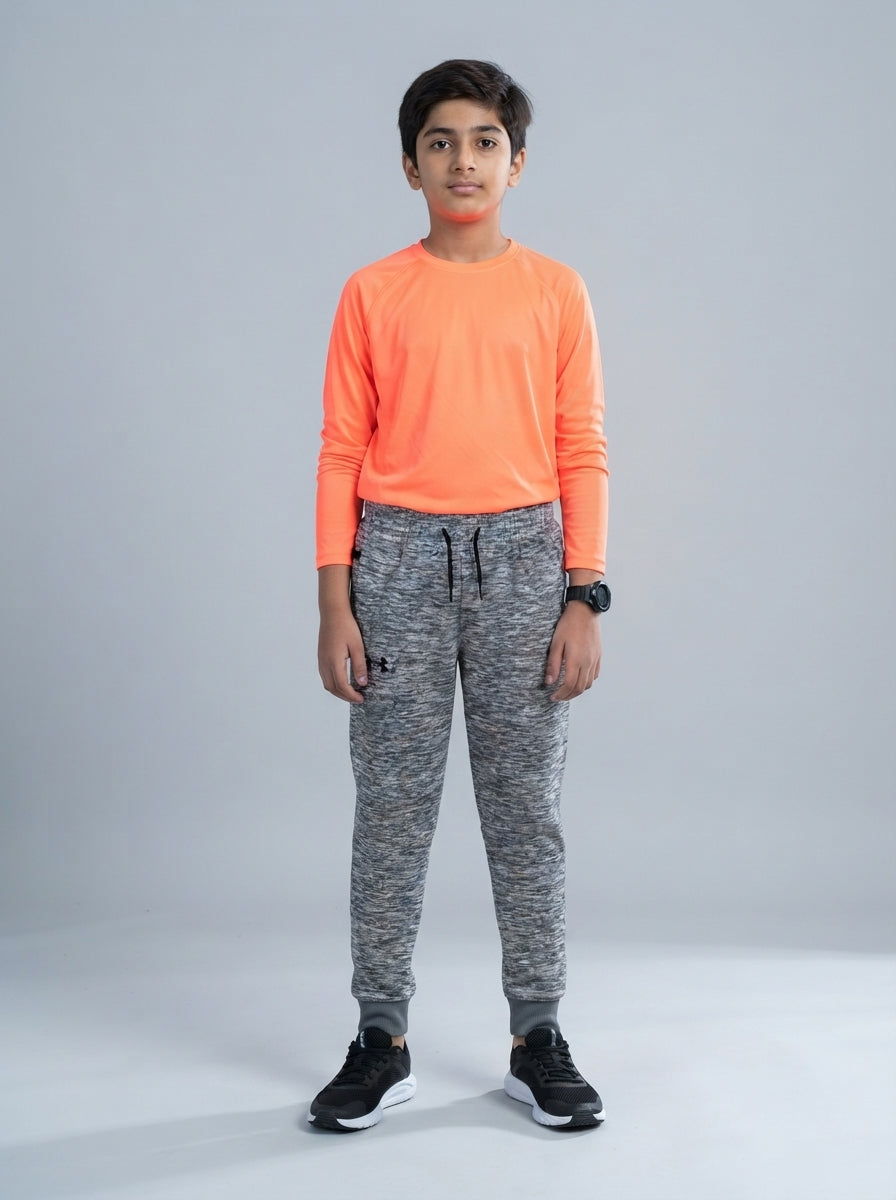 Preloved Under Armour teen boys' sports trouser, size 10-12Y, worn by a model, styled