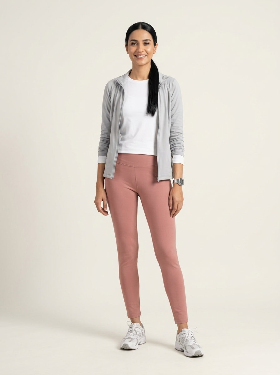 Preloved Uniqlo women's sports leggings, size XS, worn by a model, styled