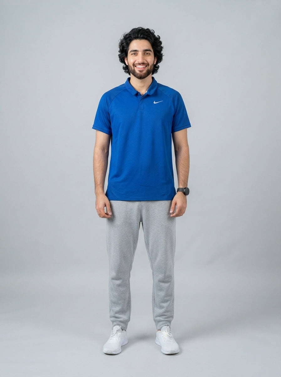 Preloved Nike men's sports polo, size XL, worn by a model, styled